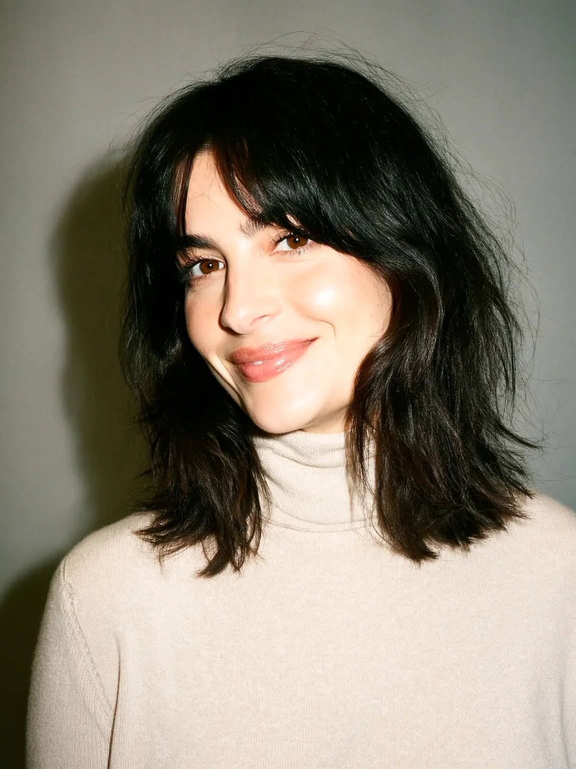 Shoulder-Length Textured Layers with Curtain Bangs
